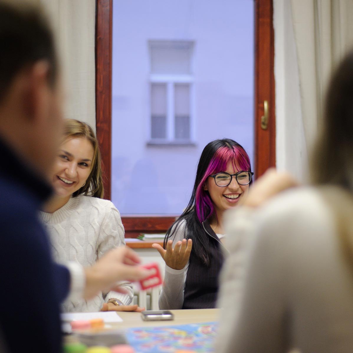 Entrance of Language Atelier school in a historic yellow building in Prague