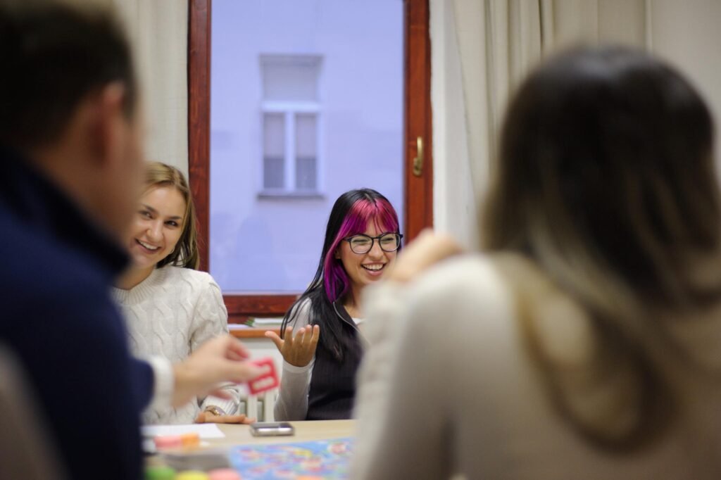 Small classes at Language Atelier German Courses. Students smiling during a German class