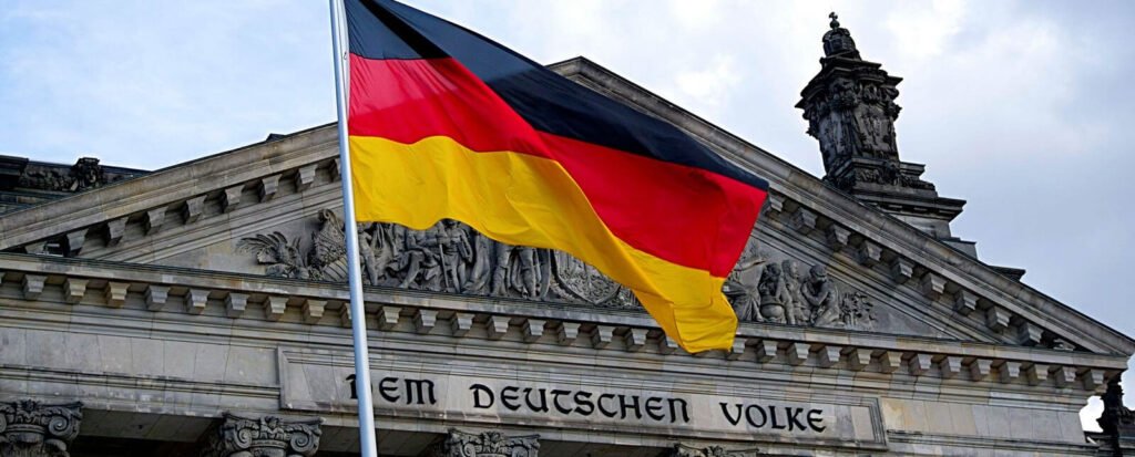 German flag waving in front of Berlin's Reichstag building for language and culture context