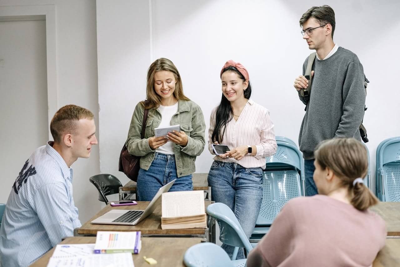 International students smiling and talking during a class in Prague