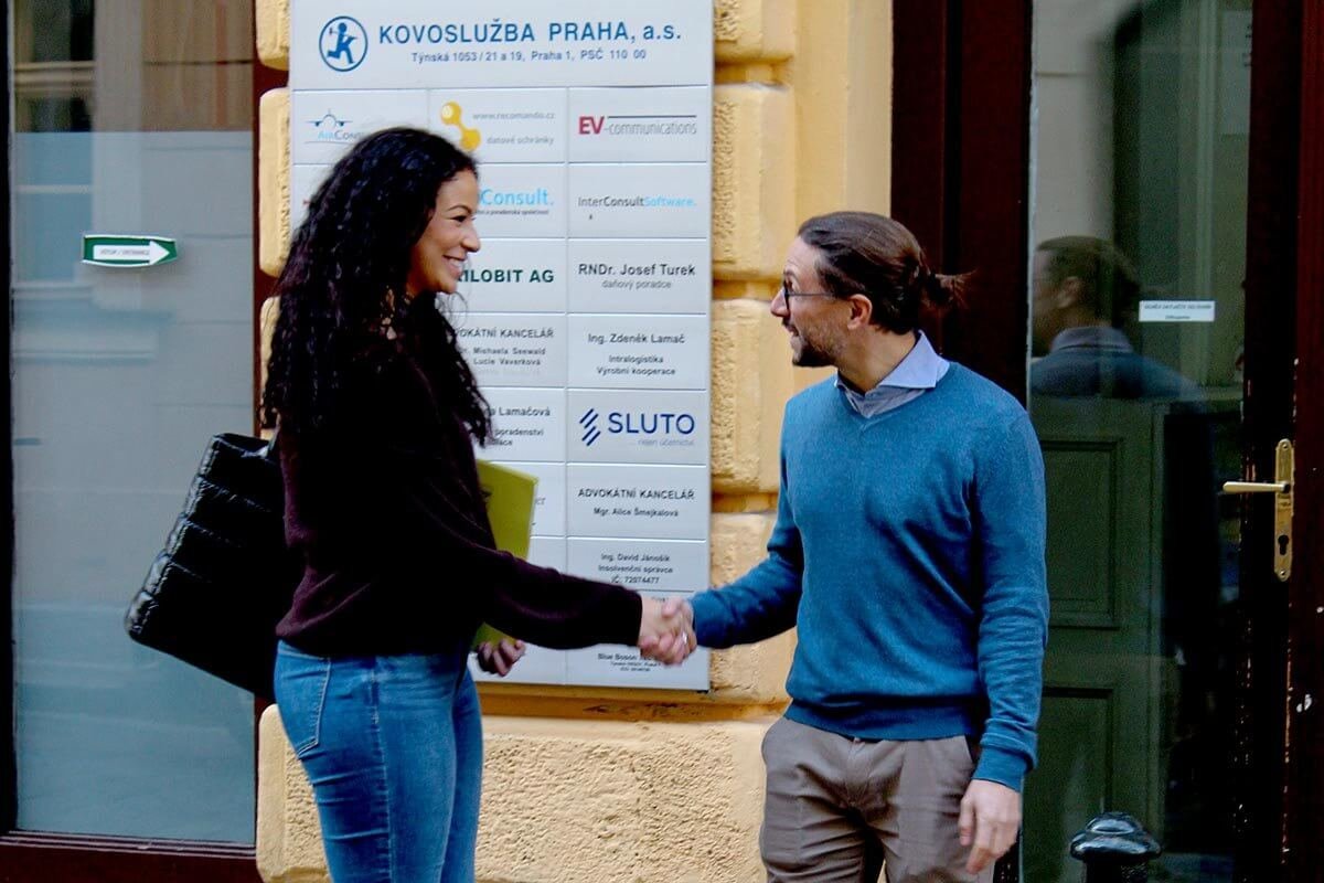 Student being welcomed in front of Language Atelier school in Prague