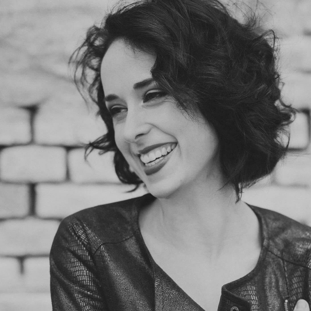 Portrait of Anna, a smiling teacher at Language Atelier