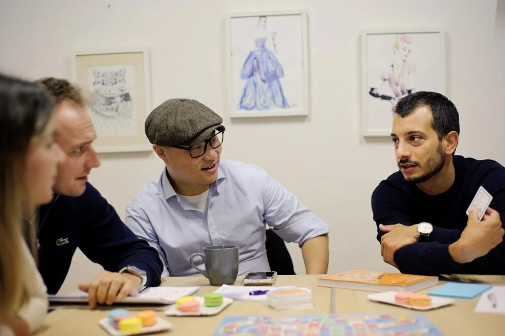 Group of students doing a language role-play activity in class