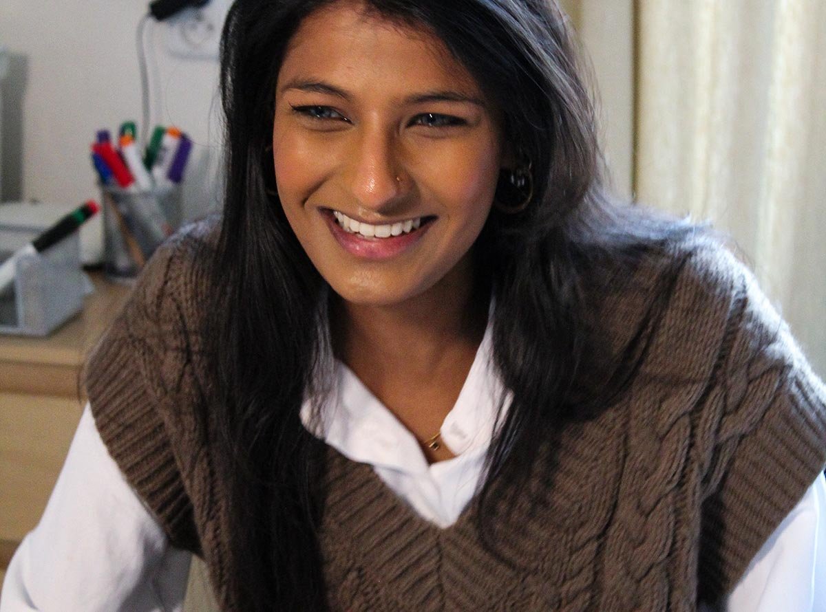 Smiling student attending an online Czech language class from home